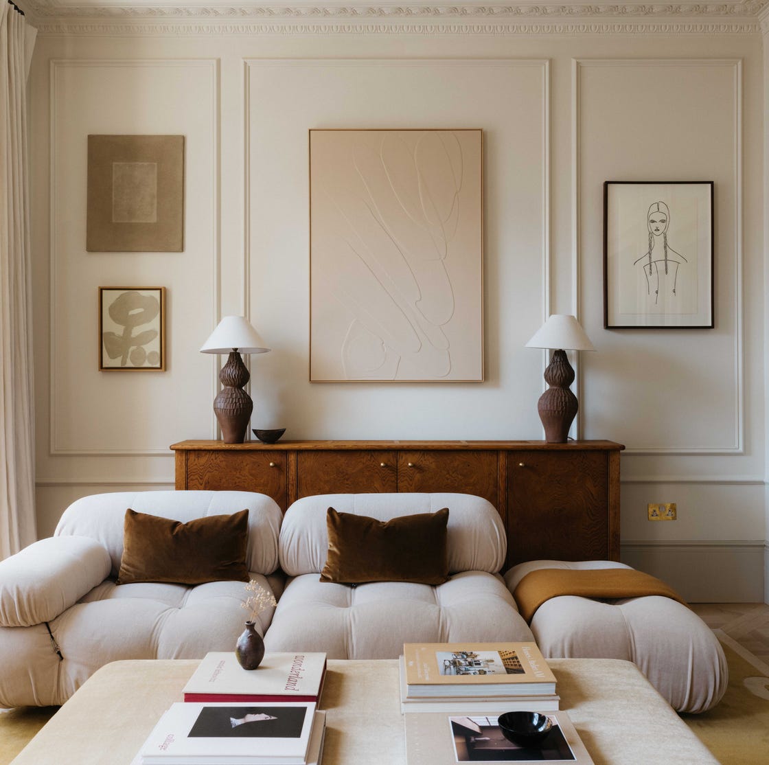 Warm neutral room with layered interior details and wall finish
